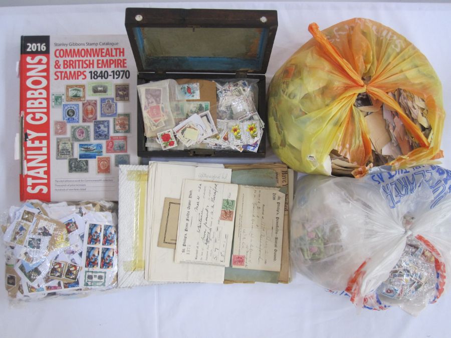 Book of loose stamps plus wooden box of stamps, a stockbook and an album of miscellaneous philatelic