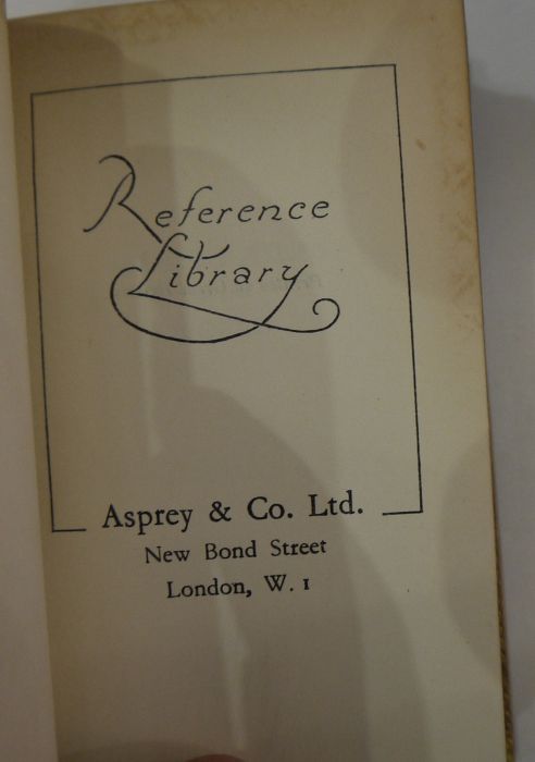 Small carved oak bookcase labelled Asprey, London, made in England containing reference library - Image 3 of 6