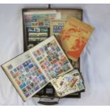 Suitcase with three albums and various loose stamps. First day covers and few on leaves. Mostly