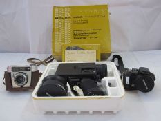 Three vintage cameras; Bolex 680 MACRO-ZOOM super 8 camera, Olympus SP-560UZ18x optical zoom camera.