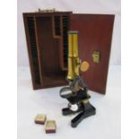 Mahogany cased microscope with various glass slides (mostly empty) and set of boxed glass circles