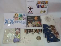 A collection of commemorative and brilliant uncirculated coins in original cards and boxes to