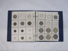 Folder containing various crowns, half crowns, shillings and other denominations of various grades.