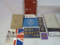 A collection of commemorative and uncirculated coins to include definitive coin sets in original