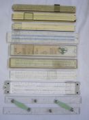 Collection of 9 vintage slide rulers in contemporary cases