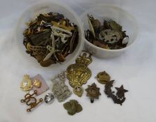 Collection of military and other cap badges to include The Royal Dragoon Guards, The Devonshire