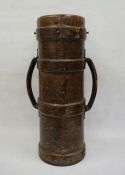 WWI twin-handled leather artillery shell carrier marked 'JAH' and with the Armed Forces arrow to the