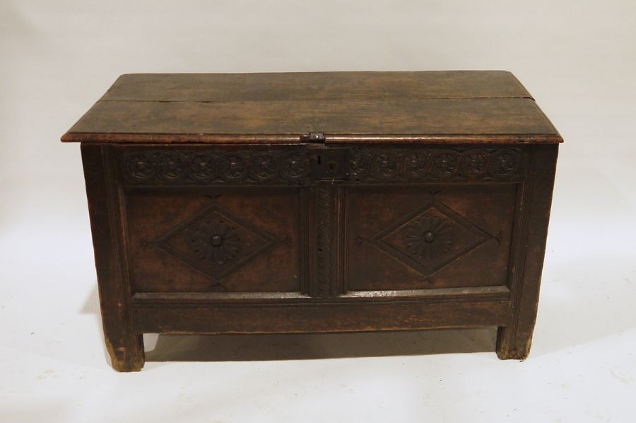 Possibly 17th century and later oak coffer, the rectangular top with moulded edge, diamond carved