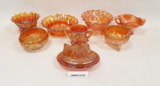 Large collection of carnival glass, early 20th century, predominantly enriched in a marigold lustre,