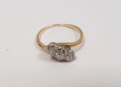 Gold and diamond three-stone crossover ring