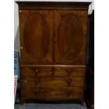 19th century mahogany wardrobe, the moulded cornice above two flame mahogany panelled doors, over