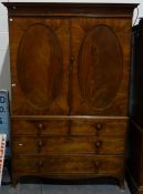 19th century mahogany wardrobe, the moulded cornice above two flame mahogany panelled doors, over