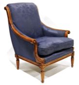 Wesley Barrell armchair with carved shew frame, blue upholstered seat and back