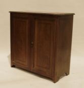 Mahogany cupboard, the rectangular top with moulded edge above two doors, on bracket feet, 76cm x