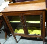 20th century mahogany glazed cabinet with two doors enclosing shelves, on square section supports,