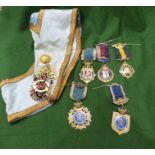 11 silver-gilt  and enamel masonic medals, a large gilt metal and enamel masonic medal attached to