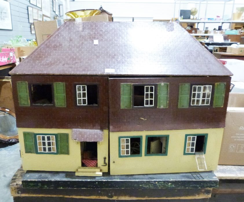 Painted wooden doll's house with various dolls house furniture and some farm animals