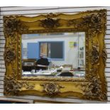 Modern rectangular mirror in heavily moulded gilt frame