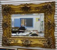 Modern rectangular mirror in heavily moulded gilt frame