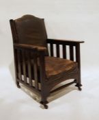 Early 20th century oak armchair with brown leather upholstered seat and back, slatted sides, all