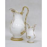 Pair of English porcelain white and gilt Rockingham style jugs in sizes, mid 19th century each