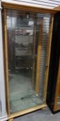 20th century pine display cabinet with two glazed doors and mirrored back, on squat bun feet, 84cm x