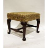 Early Georgian-style oak footstool with upholstered seat above carved oak support, on pad feet,