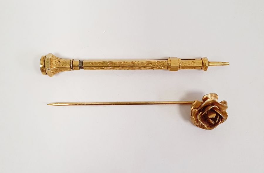 Early 20th century amethyst-topped and engraved rolled gold propelling pencil and a rose-topped