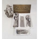Stainless steel flatware by Royalty Line, a cocktail shaker and a brass plaque featuring The Last