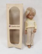 Sasha doll in yellow jumper and linen trousers