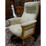 Modern Ercol reclining easy chair in beige upholstery