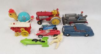 Collection of vintage toys including Rolls Royce car, battery operated No.2 red race car and