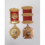 Masonic interest - two 9ct gold and enamel masonic medals, variously mounted with 9ct gold badges,