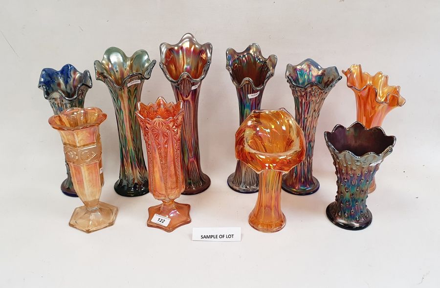 Collection of Carnival glass vases, early 20th century, in amethyst, blue and marigold colours,