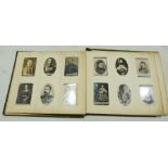 Ogdens album and contents of black and white cigarette cards, of military figures, scenes from the