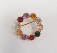 Gold-coloured metal and semi-precious stone Regard-style circular brooch, 2.5cm diameter