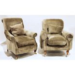 Pair of modern pale grey upholstered armchairs with shaped side rails, on turned front supports to