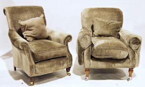 Pair of modern pale grey upholstered armchairs with shaped side rails, on turned front supports to