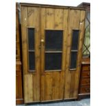 Vintage pine food cupboard with single grilled door enclosing shelves