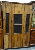 Vintage pine food cupboard with single grilled door enclosing shelves