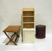 Folding table, a corner linen basket, a white painted wall-hanging cupboard and a painted