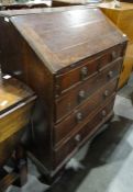 George III oak bureau with fitted interior, above two short and three long graduated drawers, on