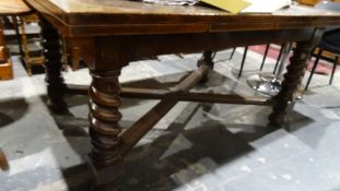 Edwardian oak draw-leaf table with barleytwist and block supports, X-shaped stretchered base