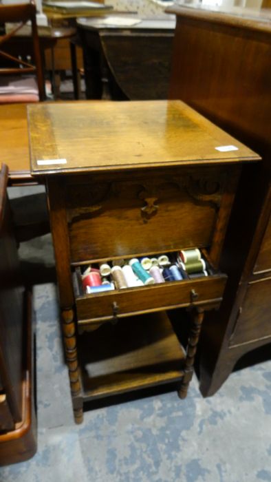 20th century oak sewing table on bobbin turned supports, and contents to include silk sewing bobbins