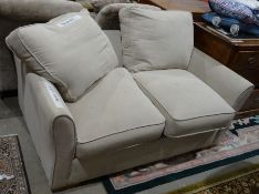 Modern sofa bed in cream upholstery
