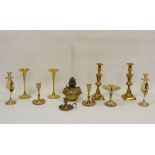 Three pairs of brass candlesticks, a brass oil lamp base, etc