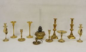 Three pairs of brass candlesticks, a brass oil lamp base, etc