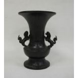 Japanese bronze flared baluster vase, Meiji, applied with two lion dog handles, the body decorated