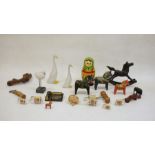 Treen decorative items to include wooden horses, Russian stacking dolls, corkscrews, small