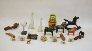 Treen decorative items to include wooden horses, Russian stacking dolls, corkscrews, small